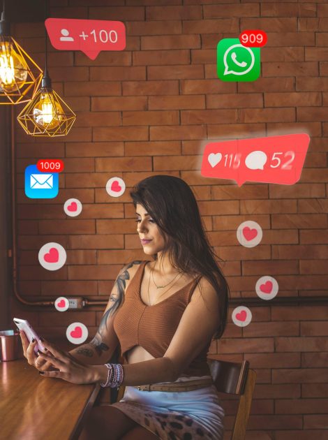 Woman using smartphone in cafe with social media notifications around.